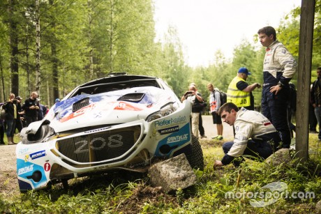 Craig Breen reviews the car after crash at FIA World Rally Championship 2015 Finland in Jyvaskula on July 30, 2015